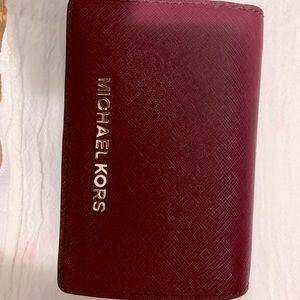 Beautiful Michael Kors burgundy red wallet.